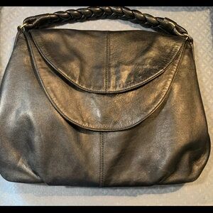 Christopher Kon Black leather Magnetic Flap closure 
Braided handle NWOT!